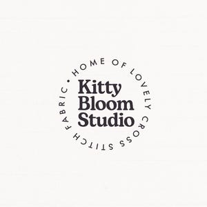 a logo for a fabric studio called Kitty Bloom Studio.
