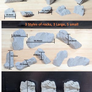 May include: A selection of 24 grey rocks of mixed sizes, with measurements in millimetres. The image includes text: "24pc Mixed Sized Rocks" and "3 Styles of rocks, 3 Large, 5 small". The rocks are of various shapes, ideal for model making or craft projects.
