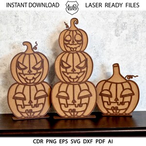 May include: Three wooden Halloween pumpkin decorations, one stacked on top of the other, with a single pumpkin to the right. The pumpkins have carved faces with eyes, noses, and mouths.