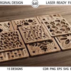 Puede incluir: Un conjunto de 15 diseños de madera cortados con láser que presentan varios patrones florales y geométricos. Los diseños están dispuestos en una pila, con el diseño superior mostrando un patrón floral con pequeños círculos. El texto "LASER READY FILES" y "15 DESIGNS" es visible en la parte superior e inferior de la imagen.