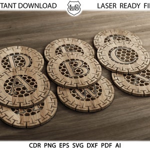 May include: Eight wooden coasters with a honeycomb design and a letter from the alphabet in the center. The coasters are stacked on top of each other. The letters are A, B, C, D, E, W, and X. The coasters are laser cut and ready to be used.
