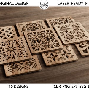 May include: A set of 15 laser-cut wooden coasters with intricate geometric designs. The coasters are arranged in a stack, with the top coaster showing a snowflake pattern. The coasters are made of natural wood and have a rustic look.
