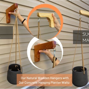 May include: Three wooden hanging plant hangers with rope and a concrete planter. The hangers are made of red oak, sugar maple, and a darker wood. The text "Our Natural Wooden Hangers with Our Concrete Hanging Planter Waltz" is at the bottom of the image.