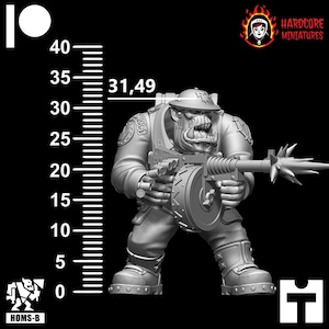 May include: A grey plastic miniature of an Orc soldier holding a large, detailed, spinning gun with a spiked barrel. The miniature is 31.49 cm tall and is standing on a black background.