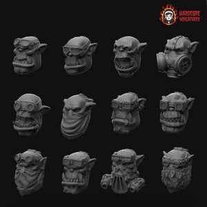 Puede incluir: Doce cabezas de orco diferentes impresas en 3D con diversas expresiones faciales y accesorios, que incluyen gafas, máscaras de gas y bandanas. Las cabezas son todas grises y tienen una superficie texturizada.