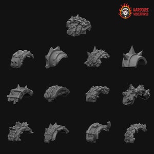 May include: A set of 14 3D printed plastic armor pieces for miniature figures. The pieces are designed to be used as shoulder pads or other armor elements. The pieces are in a variety of styles, including spiked, chained, and studded.