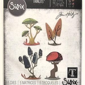 May include: A package of Sizzix Thinlits dies featuring stylized tree designs. The trees have various colors, including green, brown, and red. The package includes the text "5 DIES | 5 MATRICES | 5 TROQUELES | 5 ВЫРУБКИ | 5 STANZEN | 5 CORTANTES".