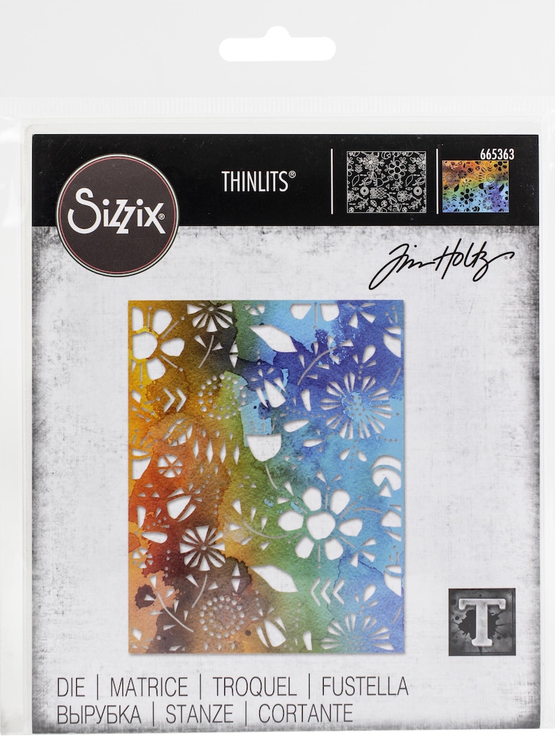 May include: A Sizzix Thinlits die set featuring a floral design with a watercolor effect in shades of orange, green, and blue. The package includes the text "THINLITS" and "Jim Holtz". The die-cut design includes flowers and leaves.