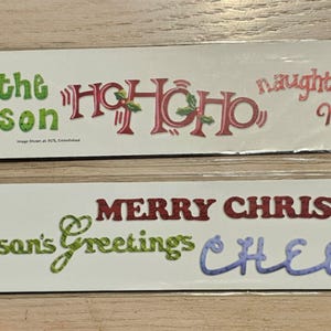 Tiras decorativas Sizzix Sizzlits con frases navideñas 655203 o 656292