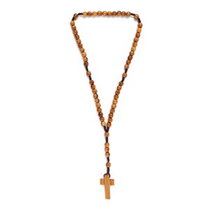 May include: A wooden rosary with light brown beads and a small cross pendant. The beads are strung on a black cord. The cross is made of the same wood as the beads.