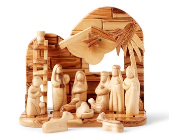 May include: A wooden nativity scene with a stable, a palm tree, a star, and figures of Mary, Joseph, baby Jesus, and the three wise men.