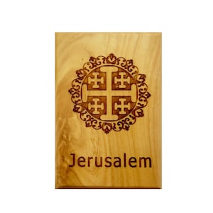 May include: A wooden plaque with a Jerusalem cross design and the word "Jerusalem" engraved in the wood.