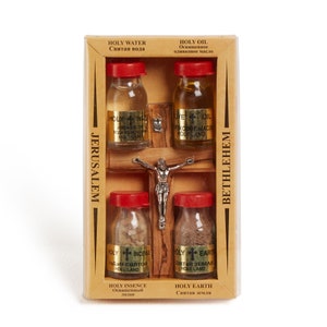 May include: A wooden box containing four small glass bottles of holy water, holy oil, holy incense, and holy earth from Jerusalem and Bethlehem. The box features a cross and is labelled with the names of the holy sites in English and Russian.