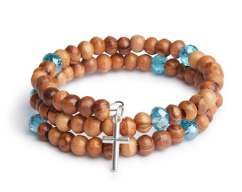 Handmade Wrap Around Olive Wood Bracelet With Light Blue Bead Detail With Silver Jerusalem Cross
