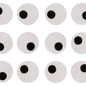 May include: Twelve white, circular patches, each with a black circle on the side. The patches are arranged in three rows of four. The black circles are all the same size and are positioned in the same place on each patch.
