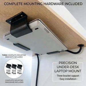 May include: A black metal under-desk laptop mount securing a silver laptop beneath a wooden surface. The set includes three brackets and mounting hardware. Text on the image reads: COMPLETE MOUNTING HARDWARE INCLUDED, THREE COMPLETE MOUNTING BRACKETS INCLUDED, PRECISION UNDER-DESK LAPTOP MOUNT, Three bracket support, Easy installation, GBL Gifts.