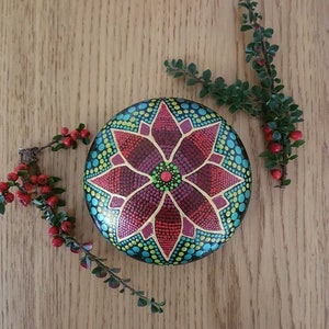 Christmas style mandala dot art on a moulded stone. Handpainted.