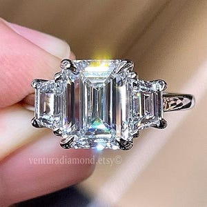 2.5 Carat E Color VS1 Clartity Lab Grown Emerald Cut Three Stone Diamond Engagement Ring Side Trapezoid Diamonds 18k White Gold Ring