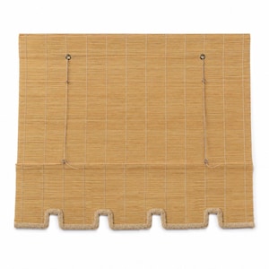 May include: A rectangular bamboo window shade in a light tan color, featuring a woven texture with vertical stitching. The bottom edge has a scalloped design finished with a thick, light-colored braided trim and two thin pull cords attached.