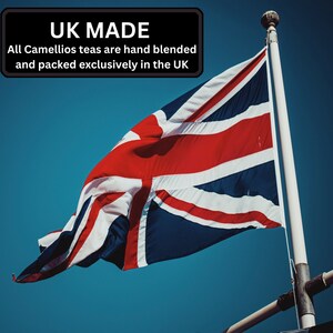 May include: A Union Jack flag waving in the wind against a bright blue sky. The flag is red, white, and blue with the Union Jack design in the upper left corner. The text "UK MADE" is in a black box above the flag. The text below the box reads "All Camellio teas are hand blended and packed exclusively in the UK."