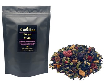 May include: A black pouch with a white label that reads "Camellios Forest Fruits" and a description of the tea blend. The pouch is next to a pile of loose leaf tea with berries, fruits, and flowers.