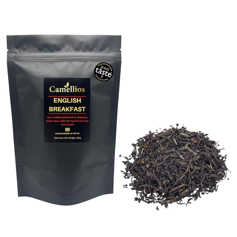 May include: A black resealable pouch of English Breakfast tea with the brand name Camellios and the text "Our traditional blend of delicious black teas, with strong flavour and rich aroma. Hand blended in the UK. Minimum Net Weight 200g." A pile of loose leaf black tea is in the background.