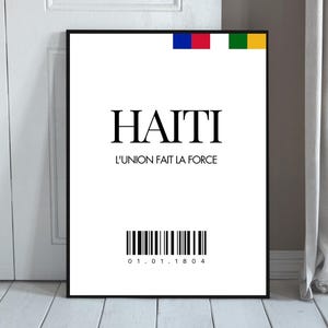 May include: A black and white poster with the word "HAITI" in large bold letters. Below the word is the phrase "L'UNION FAIT LA FORCE" in smaller letters. A barcode with the numbers "01.01.1804" is below the phrase. The poster has a blue, red, and green flag design in the top right corner.