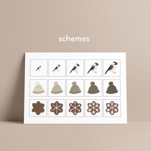 May include: A print with illustrations of birds, winter hats, and snowflake cookies. The top row shows a bird in different positions. The middle row displays hats with bobbles. The bottom row shows snowflake-shaped biscuits. The word "schemes" is written in white.