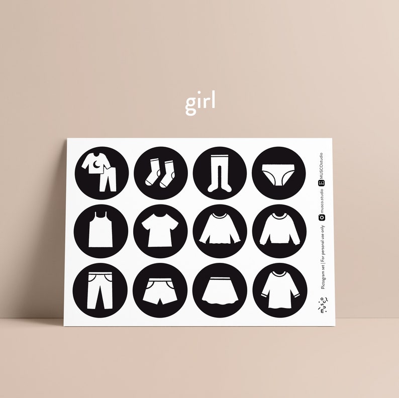 May include: A printable sheet with black and white illustrations of clothing items for girls. The sheet includes images of pyjamas, socks, leggings, underwear, vests, t-shirts, jumpers, shorts, skirts, and long-sleeved shirts. The word "girl" is printed at the top of the sheet.