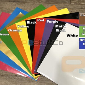 May include: A variety of colored vinyl sheets, including pink, blue, gold, green, orange, yellow, black, red, purple, white, matte black, lime green, copper, and brilliant blue. The sheets are arranged in a fan shape, with the colors blending together. The text "PBStuffCo" is visible in the center of the image.