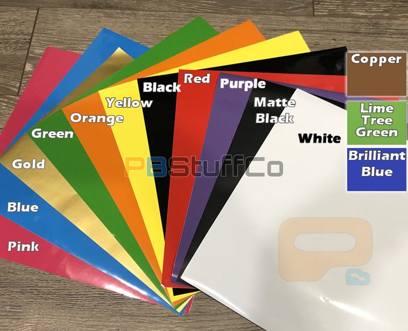 May include: A variety of colored vinyl sheets, including pink, blue, gold, green, orange, yellow, black, red, purple, white, matte black, lime green, copper, and brilliant blue. The sheets are arranged in a fan shape, with the colors blending together. The text "PBStuffCo" is visible in the center of the image.