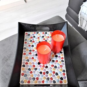 May include: A set of three ceramic mugs with a speckled, matte finish. The mugs are in shades of cream, light gray, and dark gray. Each mug has a simple, minimalist design, perfect for coffee or tea.