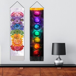 May include: Two wall tapestries with a rainbow theme. The tapestry on the left features a stack of colorful flowers, while the tapestry on the right features a stack of colorful planets.
