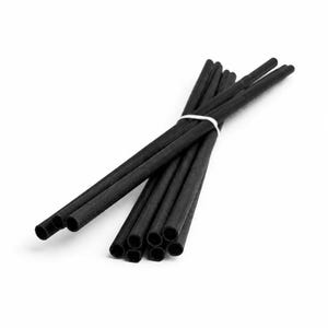 May include: A bundle of thin, cylindrical black straws arranged in a cluster and secured together with a single white rubber band. The straws have a matte texture and hollow centres, with their circular openings clearly visible at the ends.