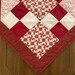 Crimson Drift Quilted Table Topper NCU0DV661