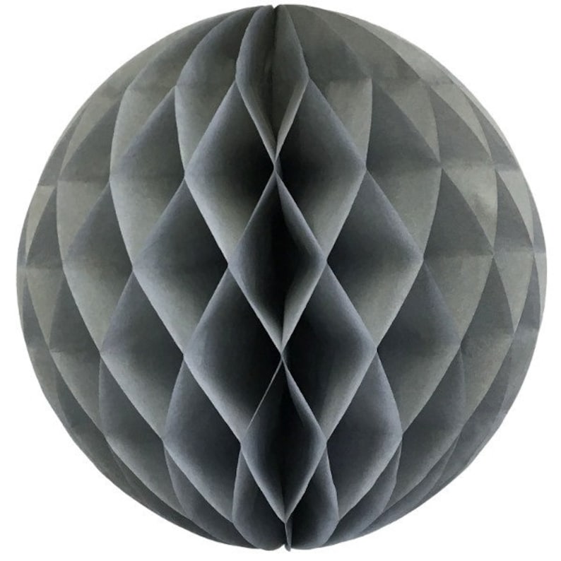 May include: A gray paper honeycomb ball decoration. The spherical ornament features a geometric diamond pattern. The paper ball is a muted gray color and is designed to be hung as a decorative element.
