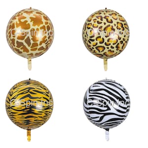 May include: Four round foil balloons with animal print designs. The balloons feature giraffe, leopard, tiger, and zebra patterns. Each balloon has a gold-coloured stem and the text "C-Spin inc" printed on the surface.