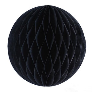 May include: A large, spherical black paper honeycomb decoration. The ball is made of folded paper, creating a diamond pattern across its surface. This decorative item is suitable for parties and events.