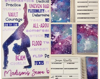 May include: A galaxy-themed notebook featuring a gymnast silhouette and words such as "gymnastics", "practice", "vault", "courage", "strength", "beam", "chalk", "uneven bar", "flexibility", "determine", "all-around", "somersault", "stick", "floor", "handstand", "flip", "focus", and "Madison's Score". The notebook has a spiral binding and pages for tracking season results, including favourite events, challenging events, and best scores.