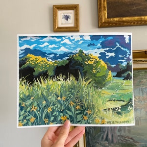May include: A painting depicting a landscape with a field of yellow flowers in the foreground, green trees and hills in the middle ground, and a blue sky with white clouds in the background. The painting is signed "Rosemilkcook" in the bottom right corner.