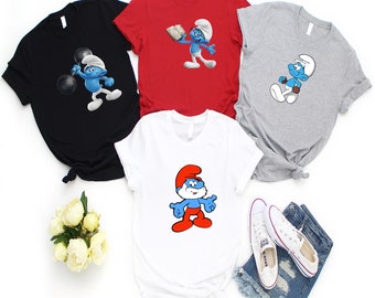 Bring Smurf-tastic Cheer to Your Outfits with Our Eye-Catching Smurfs Graphic Tee - The Perfect Gift for Smurf Fans and a Great Addition