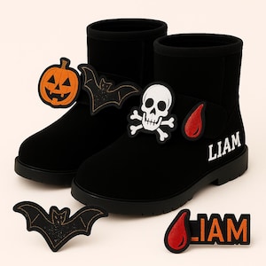 May include: Black ankle boots decorated with Halloween patches: a pumpkin, bats, a skull and crossbones, and a blood drop. The name "LIAM" is printed on one boot. Additional patches are placed around the boots.