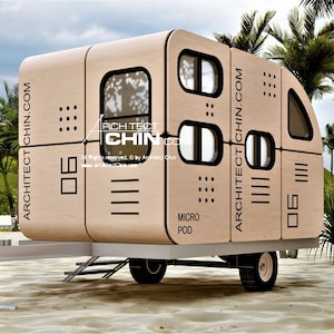 May include: A light brown, wooden, micro pod trailer with black accents and windows. The trailer is on a sandy beach with palm trees in the background. The text "ARCHITECT CHIN.COM" is printed on the side of the trailer.