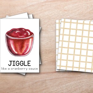 K&ouml;nnte beinhalten: Eine wei&szlig;e Karte mit roter Cranberry-Sauce in einer Glassch&uuml;ssel. Die Karte sagt "JIGGLE like a cranberry sauce".