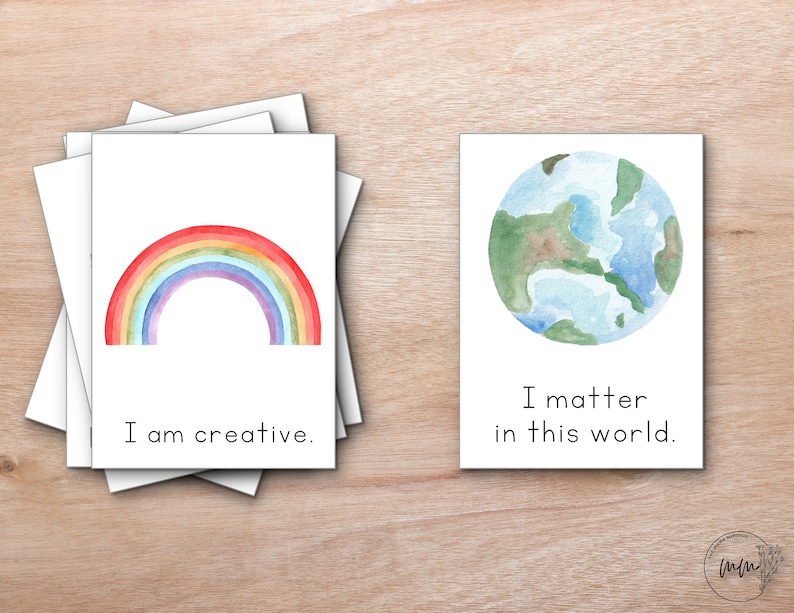 Peut inclure: Deux cartes aquarelle avec des messages inspirants. La premi&egrave;re carte repr&eacute;sente un arc-en-ciel et le texte "Je suis cr&eacute;atif". La deuxi&egrave;me carte repr&eacute;sente une peinture &agrave; l'aquarelle de la Terre et le texte "J'ai de l'importance dans ce monde."