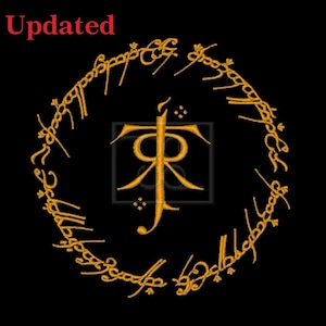 May include: An embroidery design on a black background featuring the word Updated in red text at the top left. A golden circular ring with Elvish script surrounds a central golden monogram logo consisting of the letters JR with a candle flame.