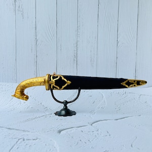 Indian handcrafted gold gilt court knife with hand carved horse head hand grip in chevron pattern welded blade.
