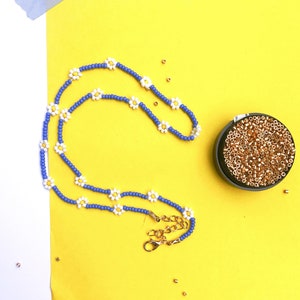 Collana di fiori di perline di roccia blu e arancione immagine 8