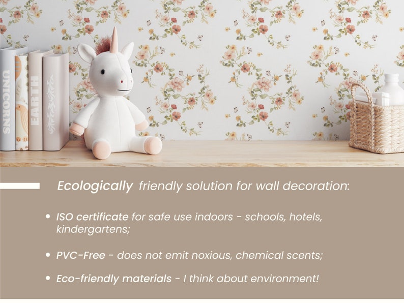 May include: A white unicorn plush toy sits on a shelf with a floral wallpaper background. The shelf also has a stack of books and a woven basket with a white bottle inside. The text below the shelf reads "Ecologically friendly solution for wall decoration: ISO certificate for safe use indoors - schools, hotels, kindergartens; PVC-Free - does not emit noxious, chemical scents; Eco-friendly materials - I think about environment!"