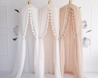 Tule Canopy  with  pom poms.  Canopy  for  nursery room.